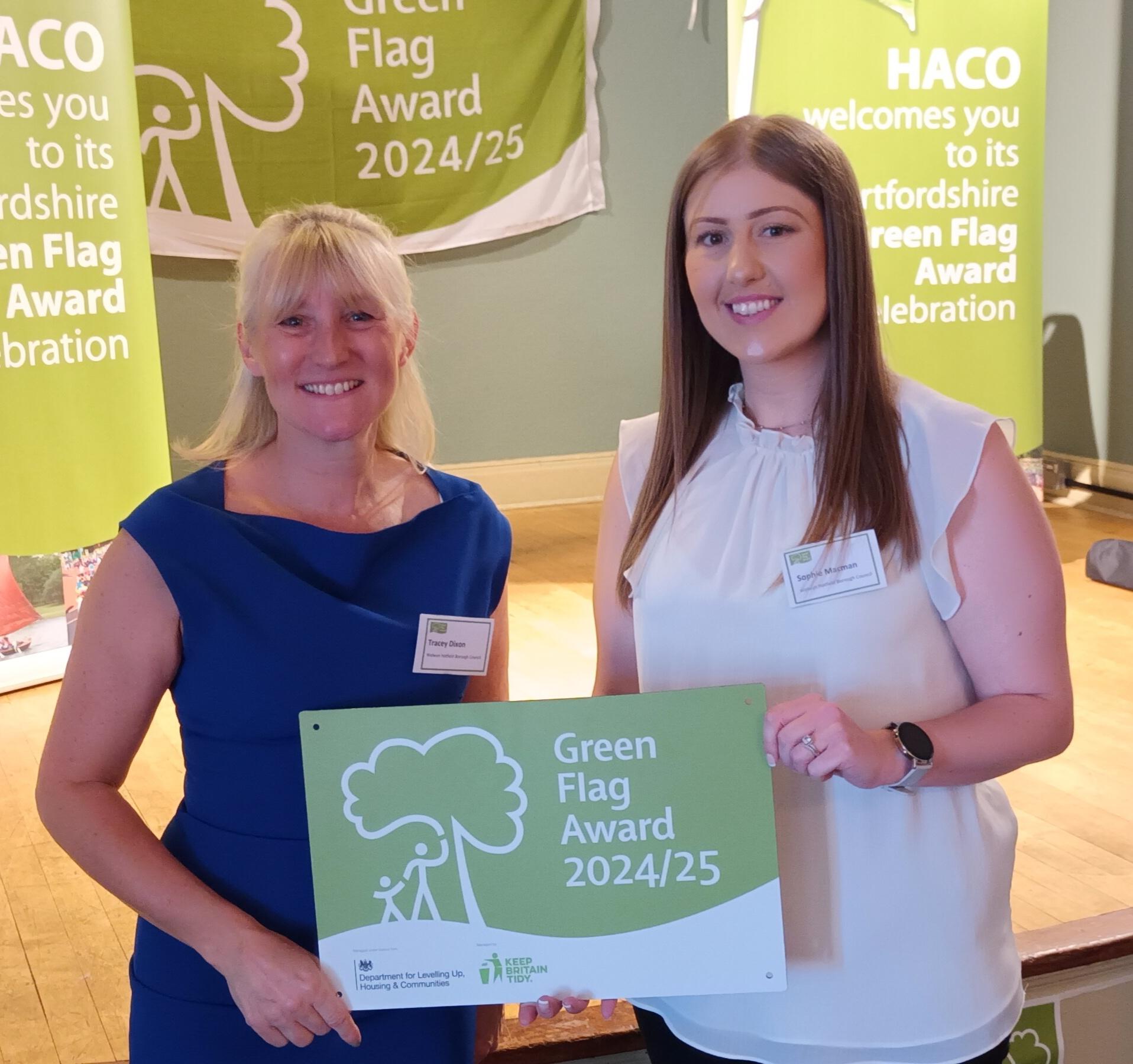 Tracey and Sophie holding a green flag award