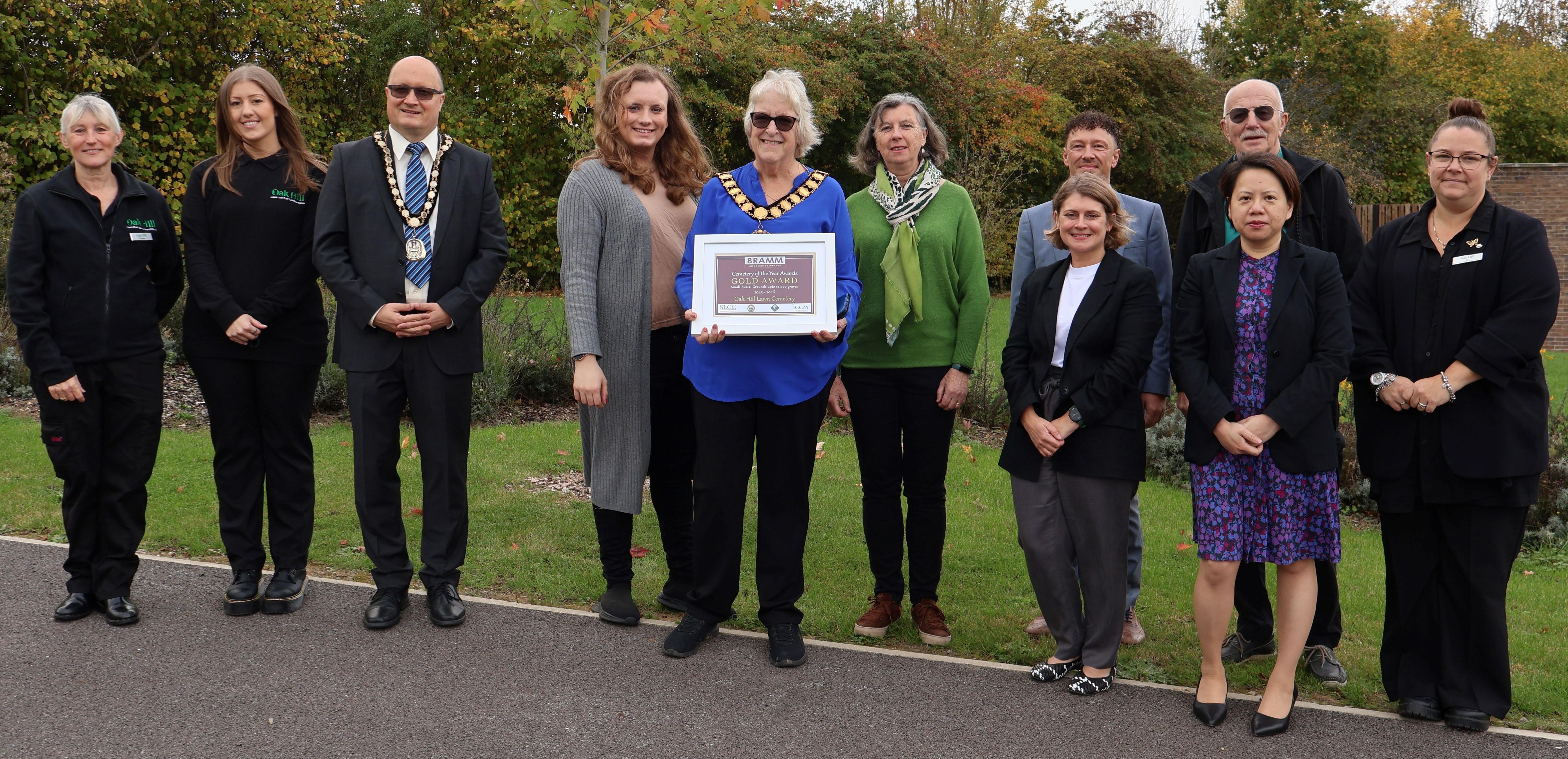 Oak Hill staff, Councillors, Chief Executive and senior officers holding gold award in cemetery