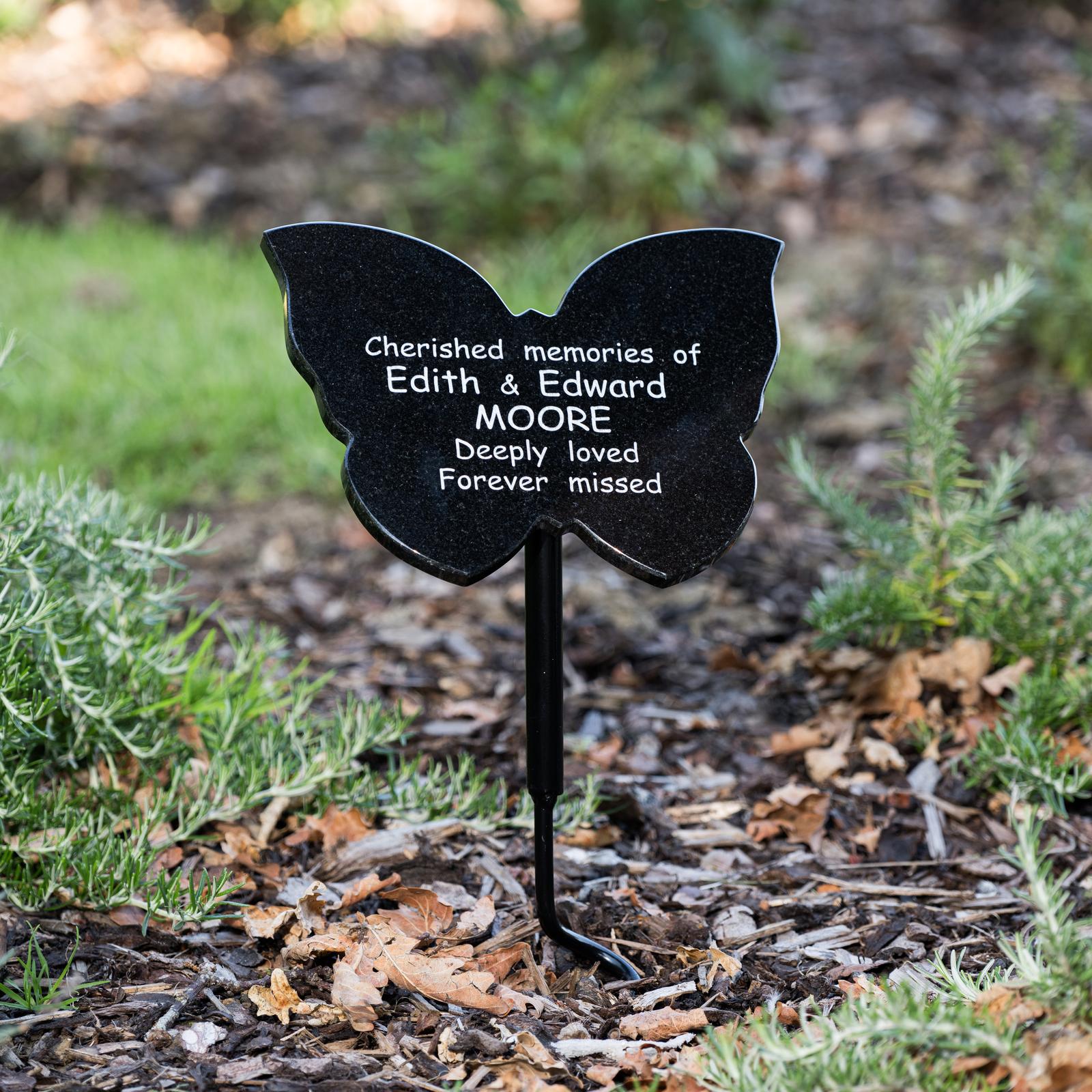 Butterfly shaped plaque in the middle of grass