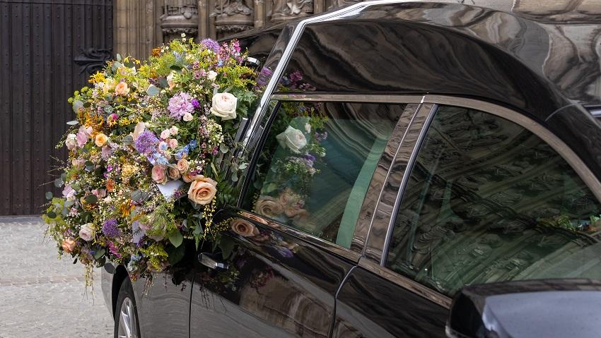 Hearse with flowers on the side